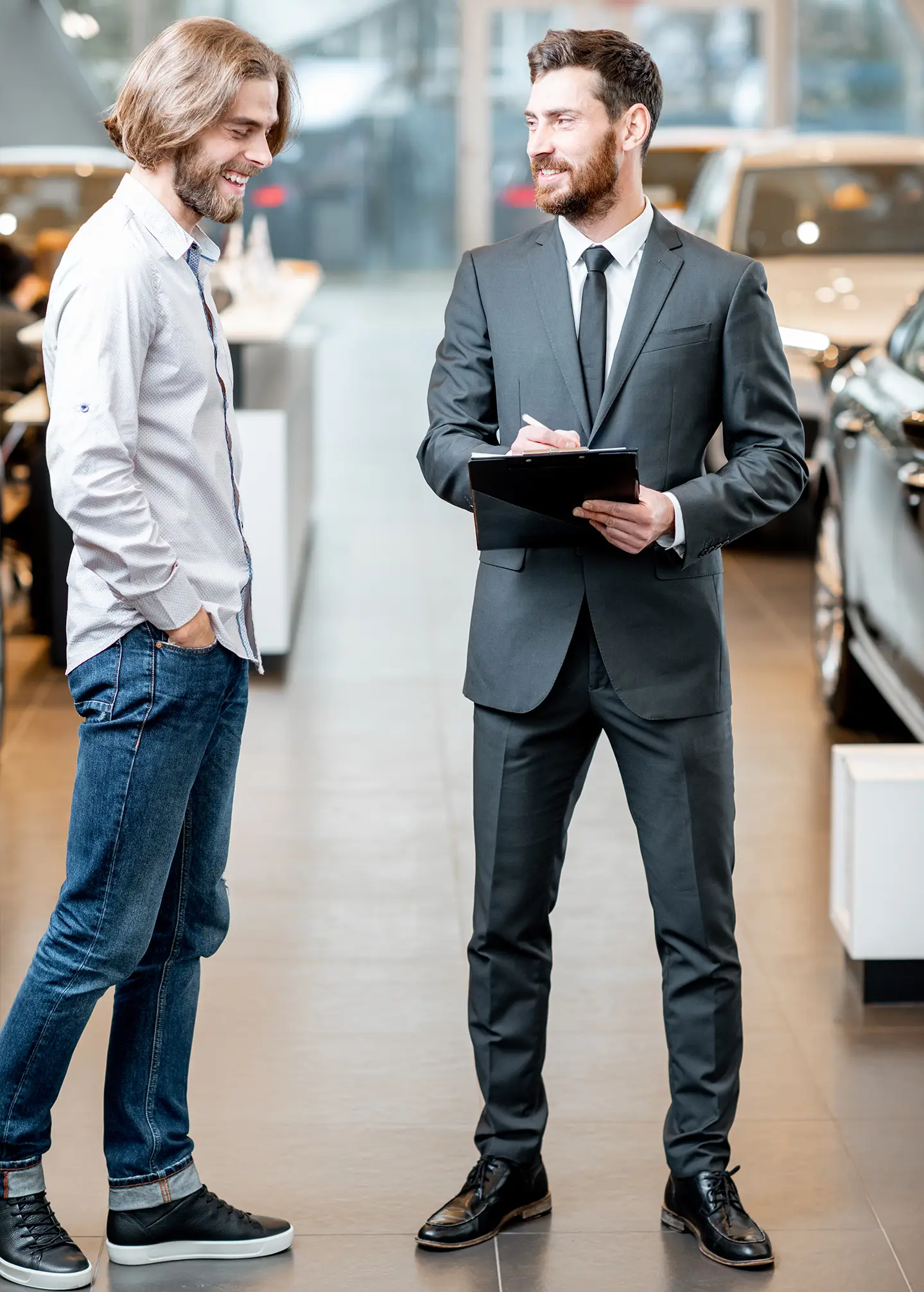 salesperson-with-client-in-the-car-showroom-2025-04-01-20-46-55-utc